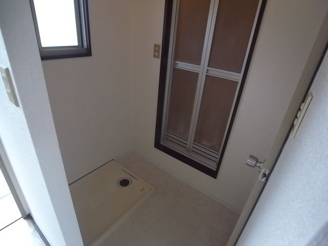 Other room space. Washing machine in the room