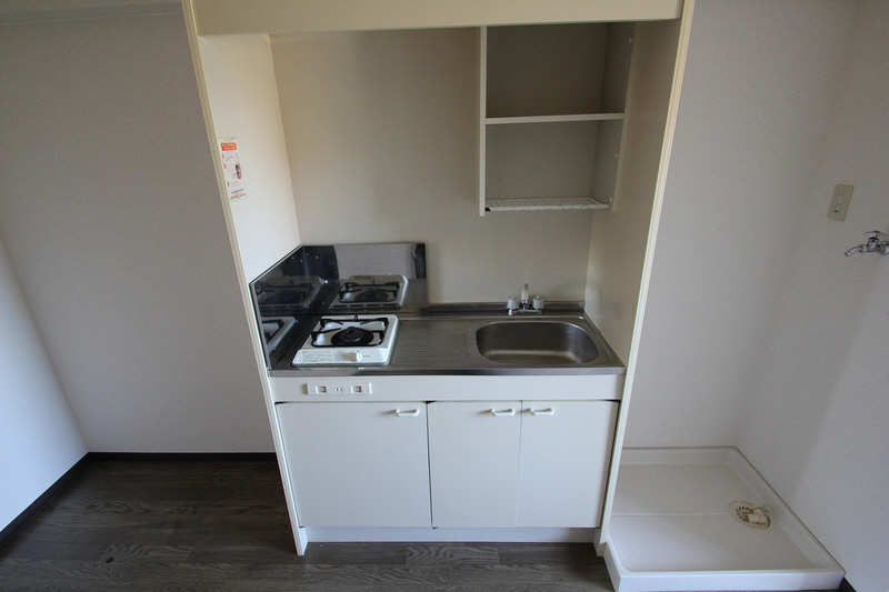 Kitchen. It is a gas stove with a kitchen