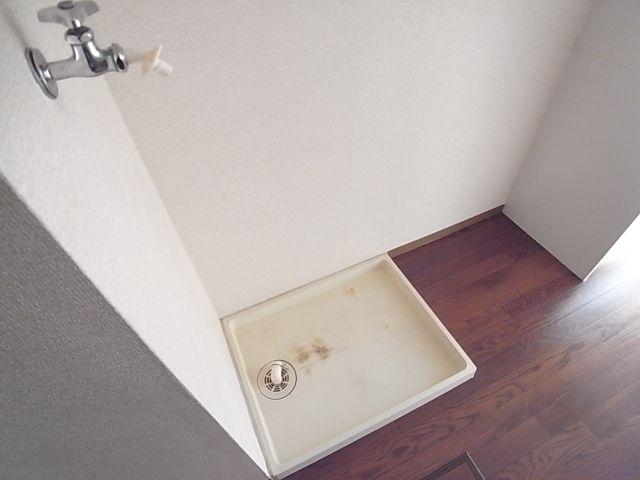 Washroom. Washing machine in the room