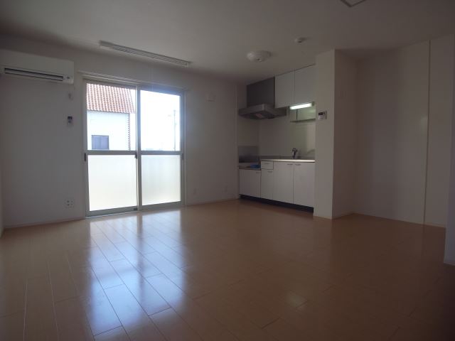 Living and room. It is bright with large windows