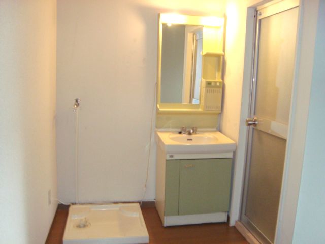 Washroom. There is a washing machine storage in the room