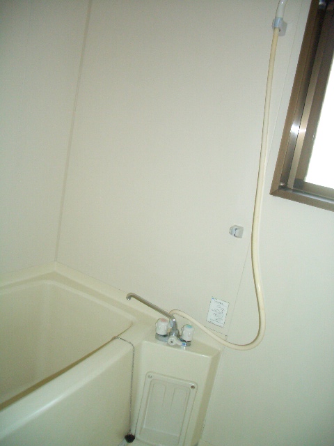 Bath. There is a window in the bathroom