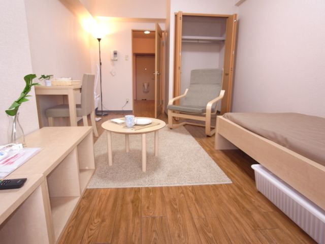 Living and room. It is equipped with stylish furniture appliances.