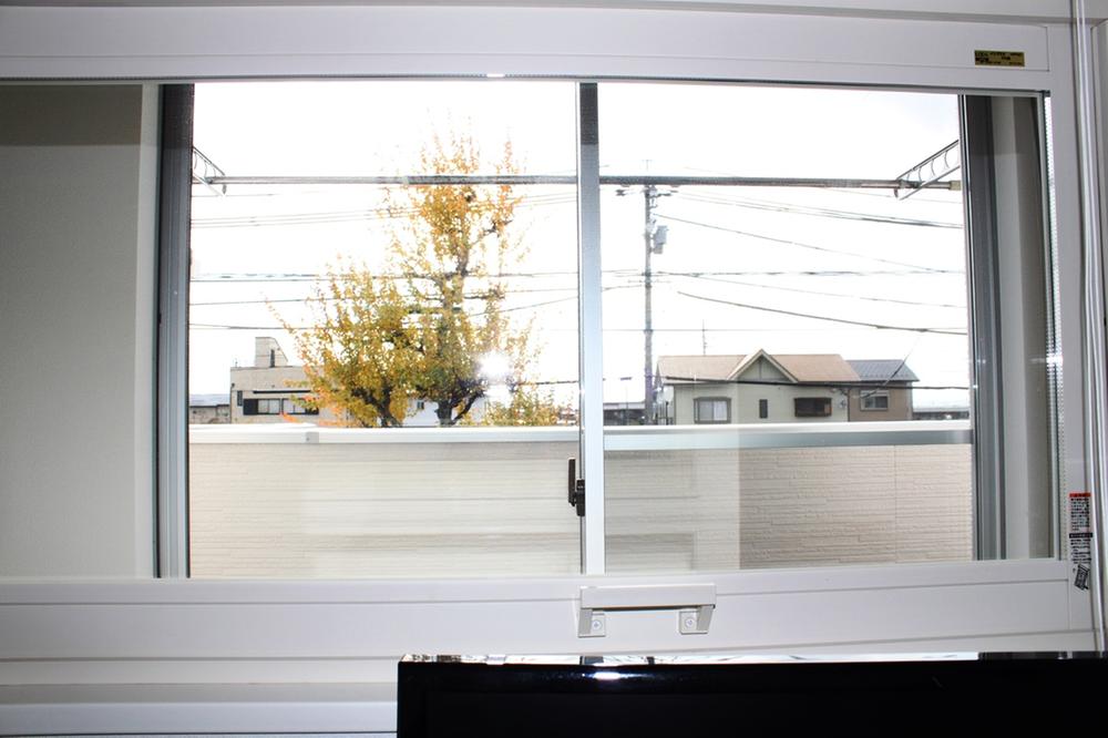 Other. Viewed from the study. Roadside tree is visible