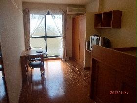 Living and room. It is a photograph of the same type of room