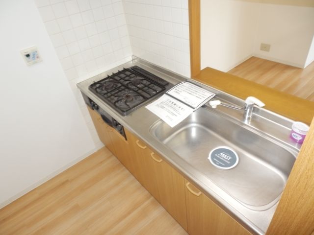 Kitchen. 3-neck is a gas stove in the kitchen.