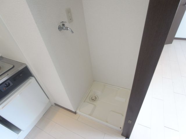 Other room space. There Laundry Area in the room.