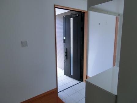 Entrance. It is a photograph of the entrance. Shoebox is white