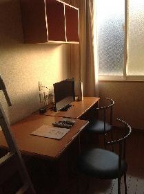 Living and room. It is a photograph of the same type of room. 