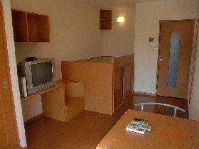 Living and room. It is a photograph of the same type of room.