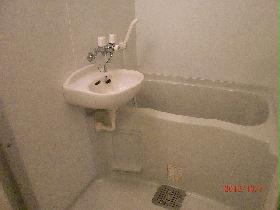 Bath. It is a photograph of the same type of room.