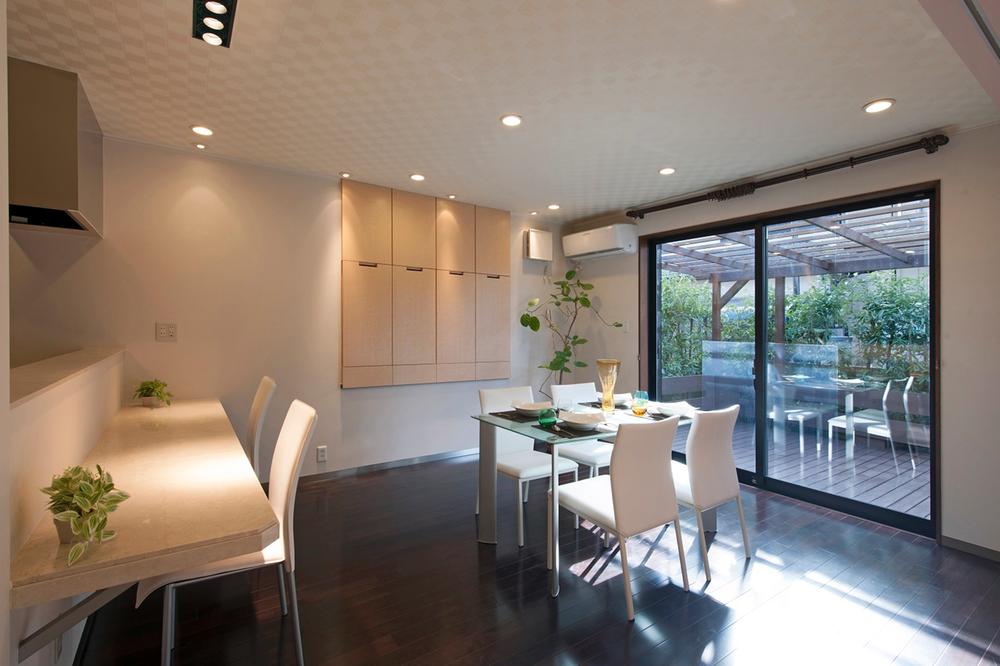 Non-living room. Meal while watching the wood deck and garden from the dining.