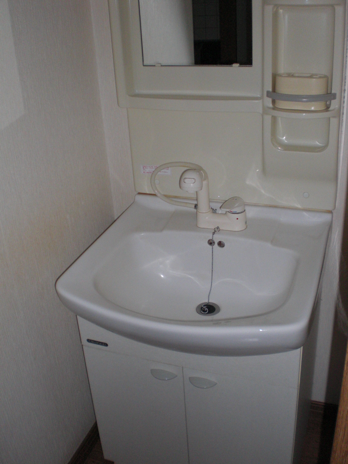 Washroom. Wash basin is useful in the shower