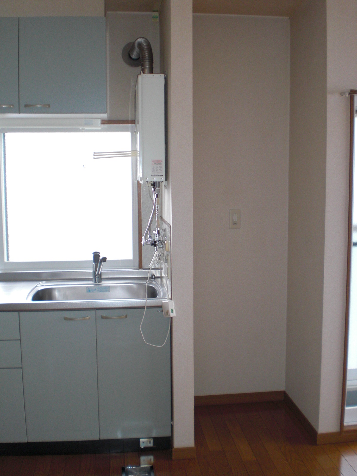 Kitchen. It is next to the sink and refrigerators Storage