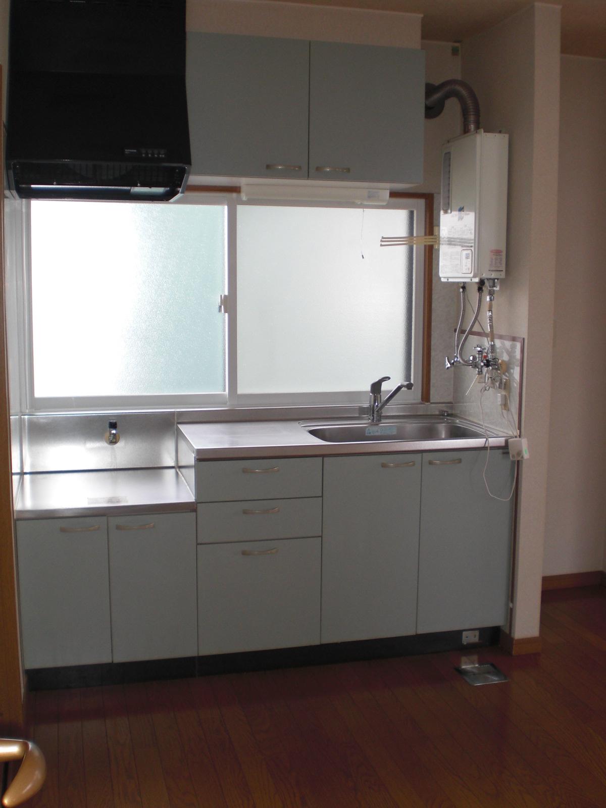 Kitchen. Outstanding storage capacity dated sink is hanging cupboard! 