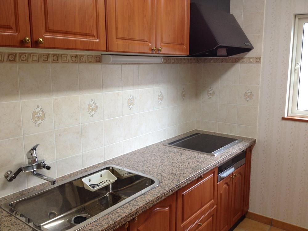 Kitchen. Range hood fan is also equipped