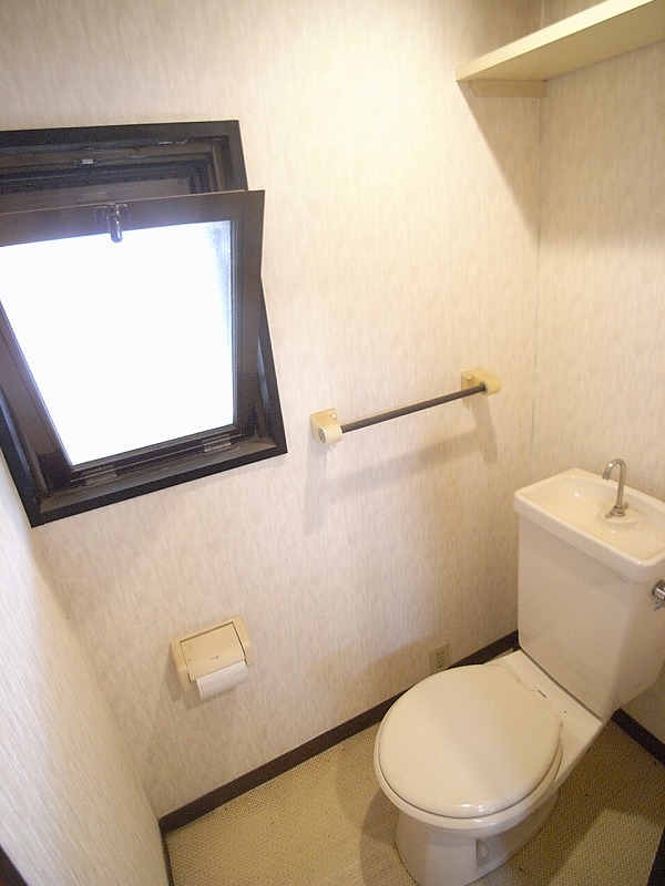 Toilet. The toilet is equipped with a window