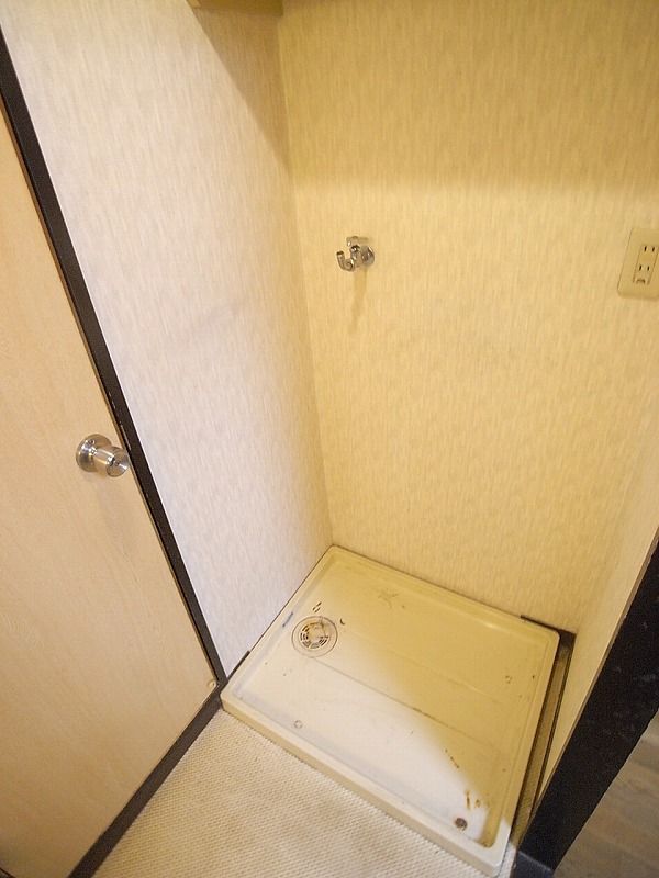 Other Equipment. Washing machine is put in a room