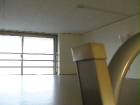 Living and room. Loft is equipped with small window