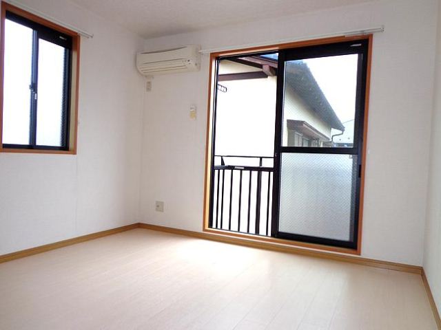 Living and room. It is a corner room.