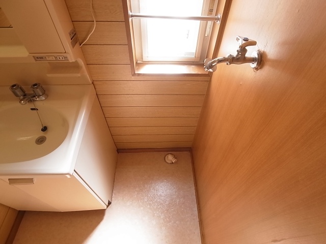 Washroom. It is indoor washing machine Storage. 