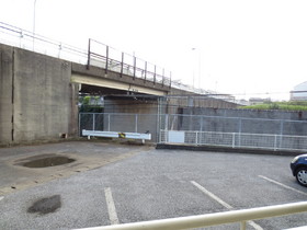 View. The front is a parking lot