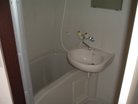 Bath. There is a wash basin in the bathroom