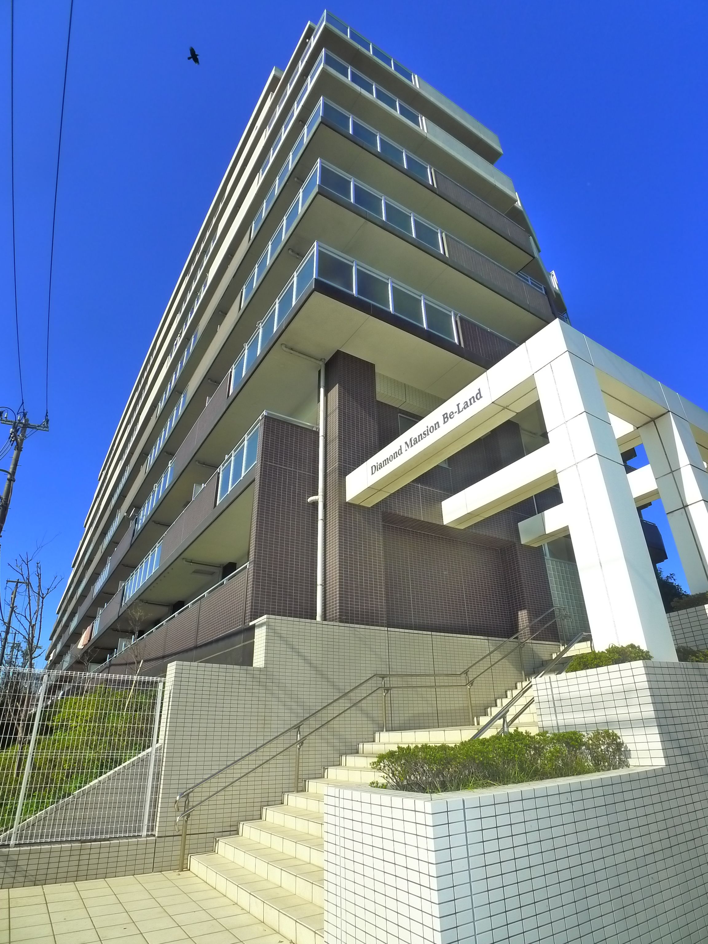 Building appearance. There is also a bus stop in front of the eye