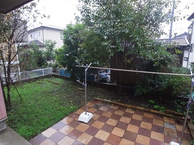 Building appearance. Wood deck, which is out of the living-dining and garden.
