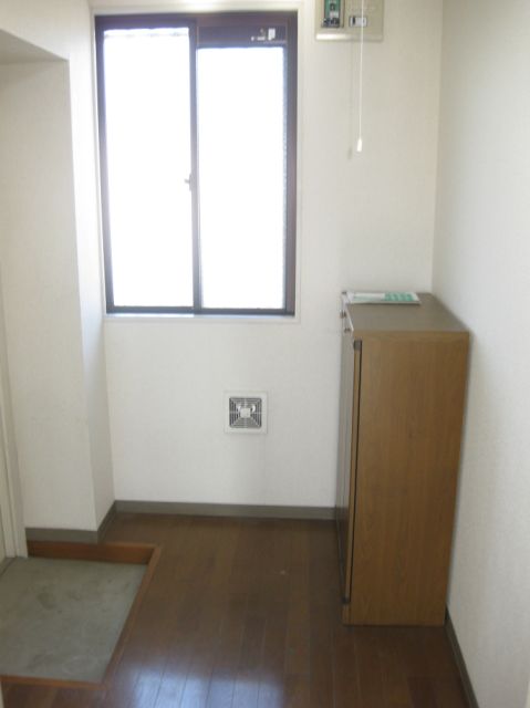 Entrance. With a convenient cupboard in the entrance!