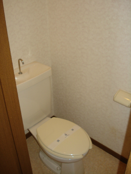 Toilet. It is a restroom with cleanliness.