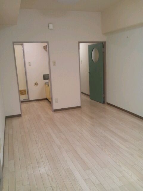 Other room space. Bright rooms with white flooring.