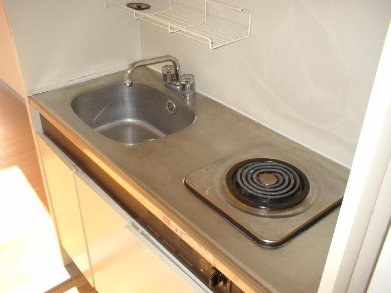 Kitchen. Electric stove. You put a cutting board