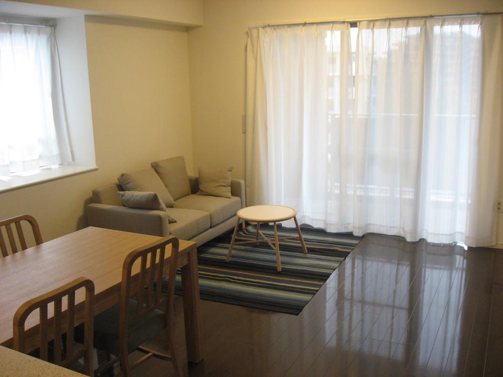 Living. Dining table, With stylish furnishings, including sofa.