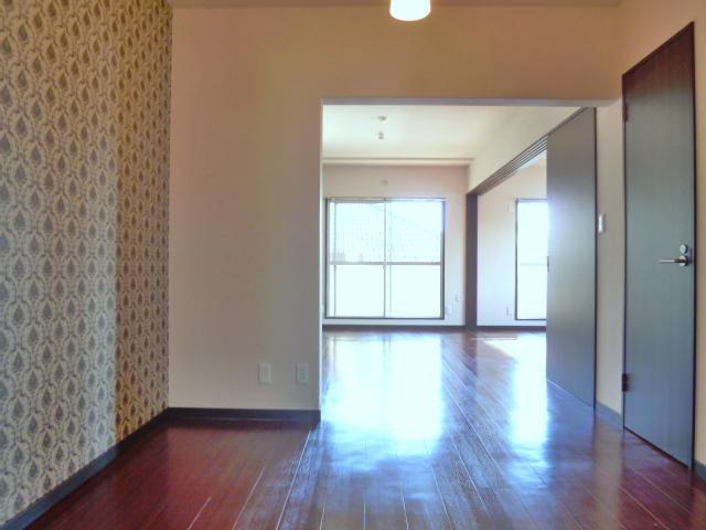 Other room space. Stylish accent wall to wall-to-wall