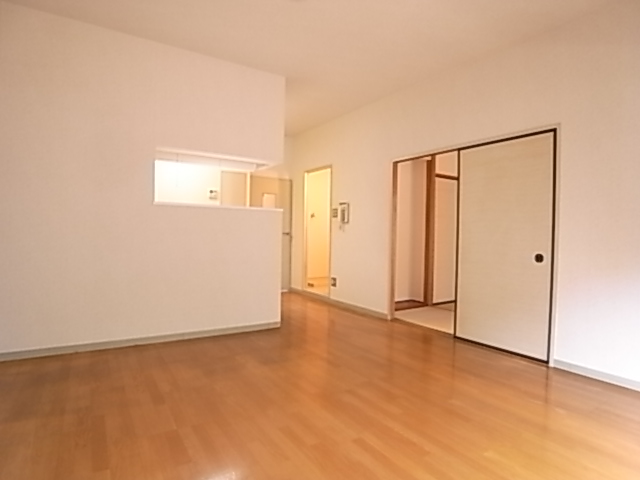 Living and room. Rooms overlooking counter kitchen. Sunny.