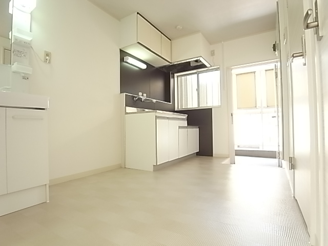 Living and room. Clean around the kitchen, which was based on white.