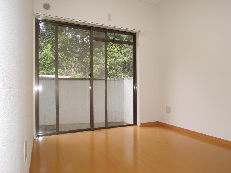 Living and room. It is a bright room with large windows.