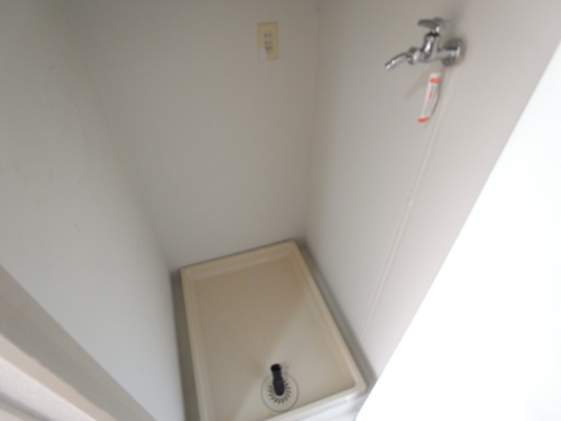 Other room space. Washing machine in the room equipped with doors