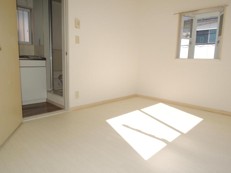 Living and room. There is a feeling of cleanliness because it is a white to keynote