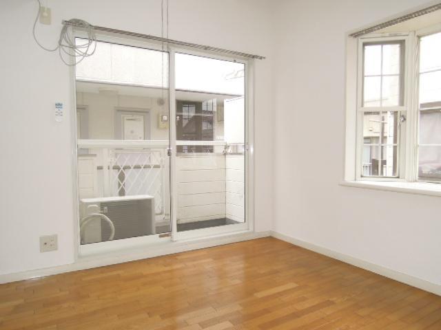 Living and room. Because the corner room has two windows