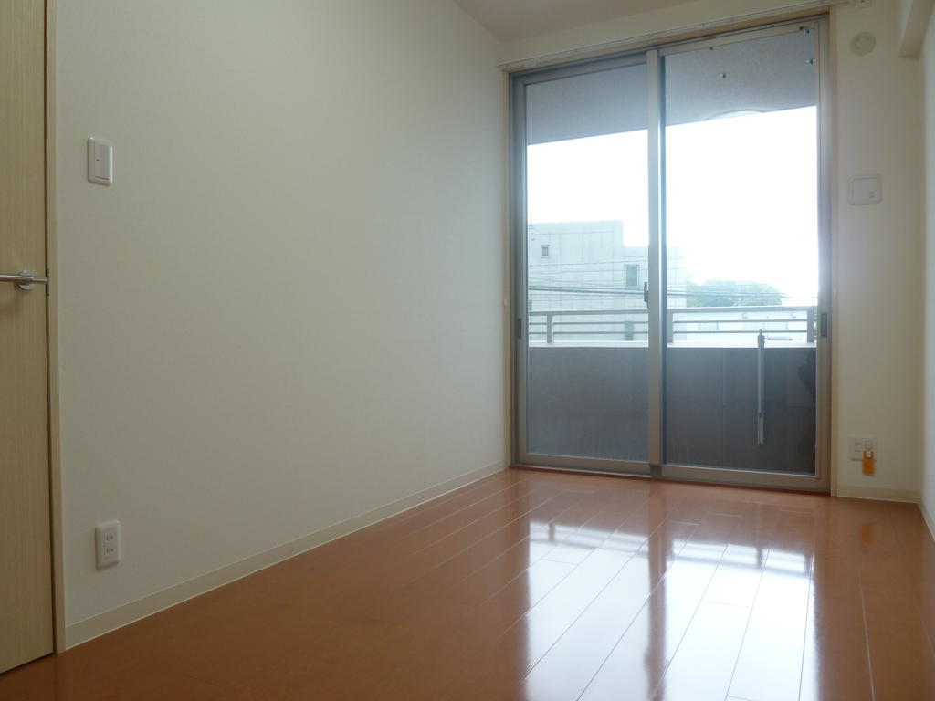 Other room space. Large windows is bright and airy.