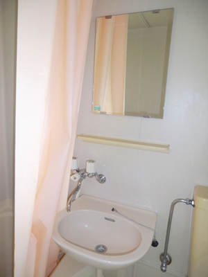 Washroom. It is with a wash basin in the bathroom