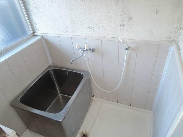 Bath. Bathroom is a hot water supply. Large is with a window.