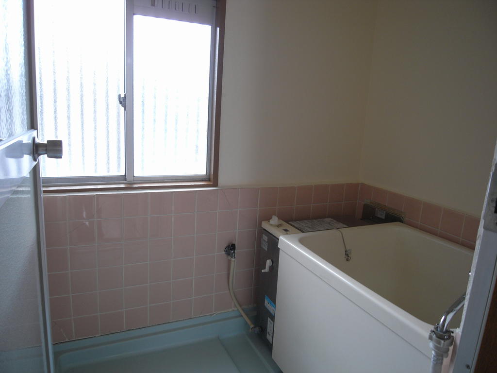 Bath. There is a window in the bathroom