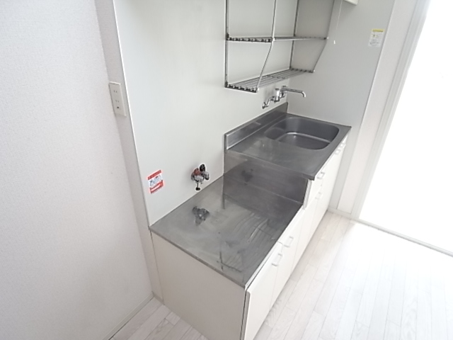 Kitchen. Large kitchen with two-burner gas stove can be installed.