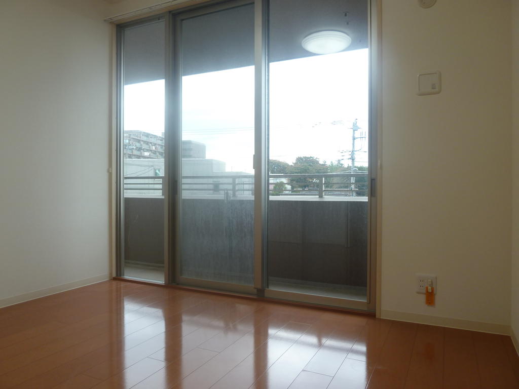 Other room space. Large windows is bright and airy.