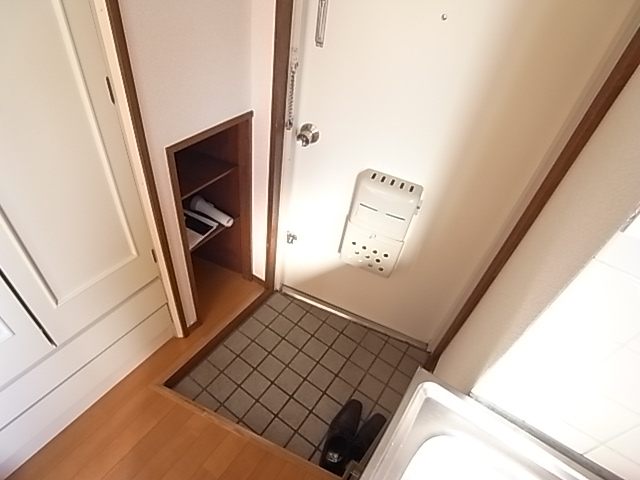 Entrance. It is small, but also equipped with front door storage.