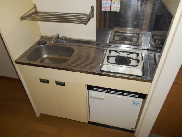 Kitchen. It comes with a refrigerator