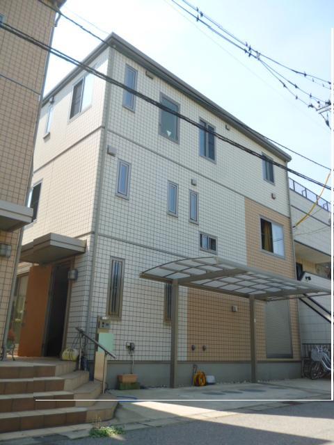 Local appearance photo. Total tiled three-story